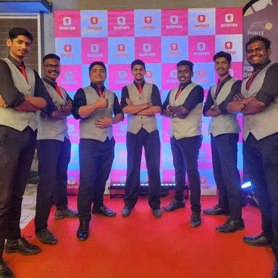Our professional team posing in front of a Swiggy and Scenes co-branded backdrop. We are a trusted partner for corporate soirees, providing trained mixologists and custom menus for brand events.