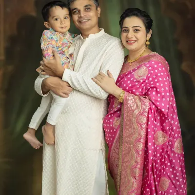 A beautiful family portrait, celebrating the journey to becoming a family of four. Capturing the bond between parents and their first child before the new baby arrives is always a special moment.