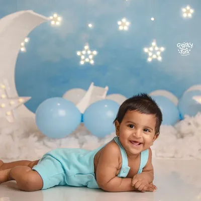 Over the moon for this little star! A six-month sitter session is the perfect time to capture those emerging personalities and adorable, gummy smiles.
