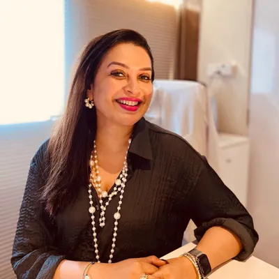 A quiet moment in my office. I believe that feeling good about yourself is a crucial part of overall wellness, and my work is dedicated to helping you achieve that.