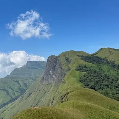 The iconic "knife-edge" ridge of Netravathi Peak on a clear day. This view is what makes the entire climb an unforgettable adventure.