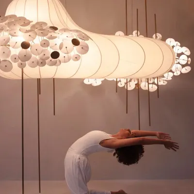 A kneeling backbend, Ustrasana, during a creative photoshoot. The soft lighting and the incredible art piece created such a magical atmosphere for practice.