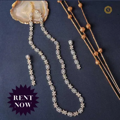 A delicate and elegant American Diamond necklace set. The simple, classic design makes it a versatile choice for receptions, parties, or even as a bridesmaid's accessory.
