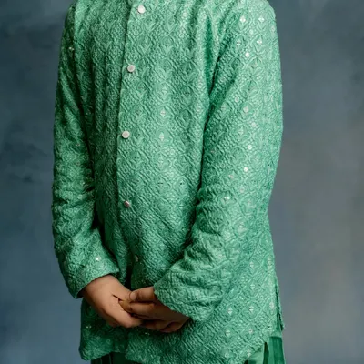 A detailed shot of the mint green Patiala kurta. The fabric's unique weave adds a subtle elegance to this comfortable and easy-to-wear festive outfit.