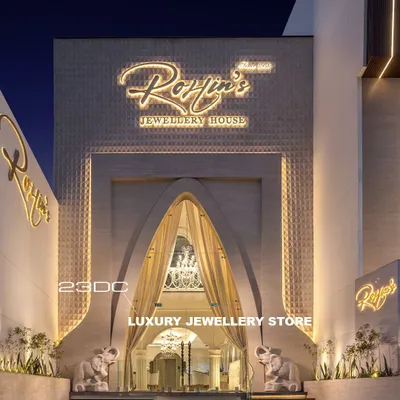 The entrance to this luxury jewellery house is designed to be a grand statement. A massive archway draped in fabric, flanked by elephant sculptures, and illuminated signage creates an inviting and opulent first impression for every client.