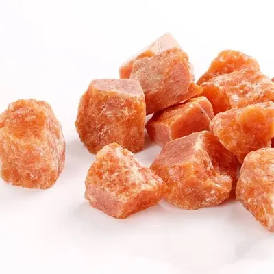 These are raw pieces of Red Aventurine, a stone known for enhancing focus and creativity. I crush and process these authentic gemstones by hand to use as pigments, infusing every painting with their natural energy and color.