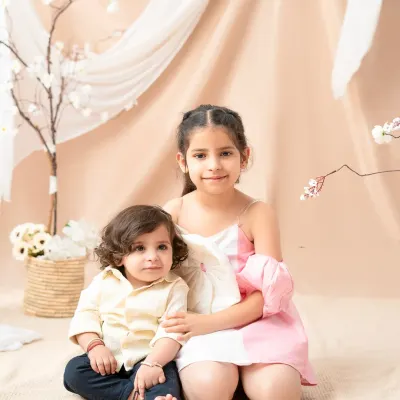 A sweet portrait of a big sister with her baby brother. Capturing the special bond between siblings is one of the most rewarding parts of my job.