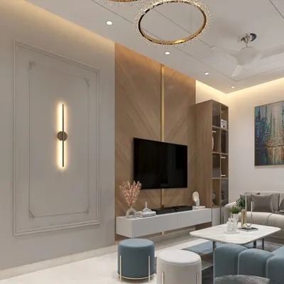 This living room combines a cool blue sofa with warm wood paneling and classic wall molding. We used a statement chandelier and modern wall sconces to create layers of light, making the space feel both cozy and sophisticated.