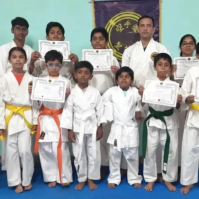 A group of my younger students proudly displaying their new rank certificates. Each certificate is a testament to their focus, discipline, and the effort they have put into their martial arts journey.