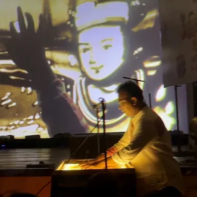 Here I am performing my sand art at a glorious meet in Guwahati. The story unfolds on the light table, projected onto a large screen for everyone to see.
