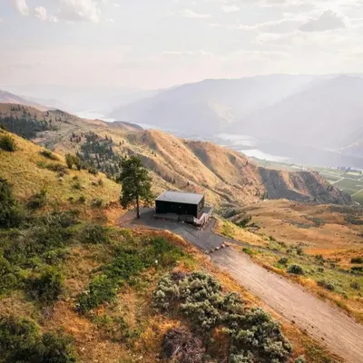 An aerial view of our modular home nestled in the hills. This design showcases how our structures can be placed in remote, beautiful locations, offering a perfect escape with minimal environmental impact.