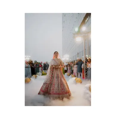 The ultimate bridal entrance. Walking through a cloud of fog, this bride looks ethereal and absolutely stunning. A true hero shot.