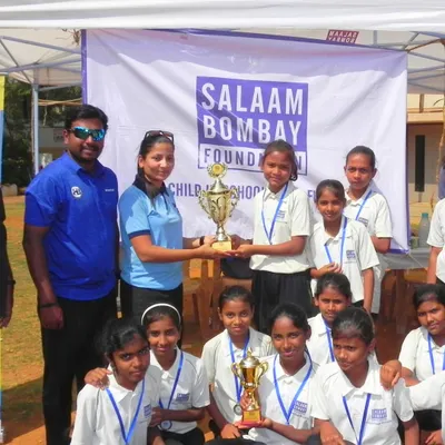 We are proud to partner with the Salaam Bombay Foundation, empowering youth through sports. Here, our coaches present a trophy to a winning team, celebrating their achievement and our collaborative effort.