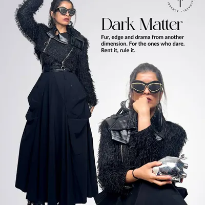 This look, 'Dark Matter', is all about drama. I've paired a black utility skirt with a textured fur and leather jacket and a metallic heart-shaped clutch to create a powerful, edgy look.