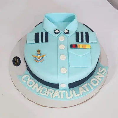A special cake for a special achievement. We created this Air Force uniform cake to congratulate our client. This is a Belgian chocolate truffle cake with detailed fondant work.