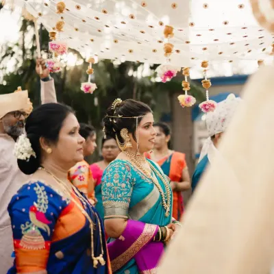 A candid moment from Ankita's wedding day. This unedited DSLR click captures her serene bridal glow, with makeup designed to look flawless both in person and in professional photos.
