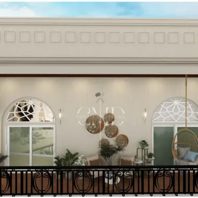 This bohemian-inspired balcony for a Noida penthouse is a tranquil retreat, featuring cane furniture, a rattan swing chair, and lush wall planters.