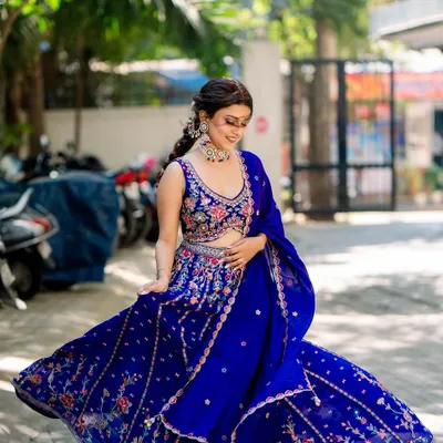 This is what it's all about. A happy client looking absolutely radiant and having the time of her life in my rented royal blue lehenga. This picture is pure joy.