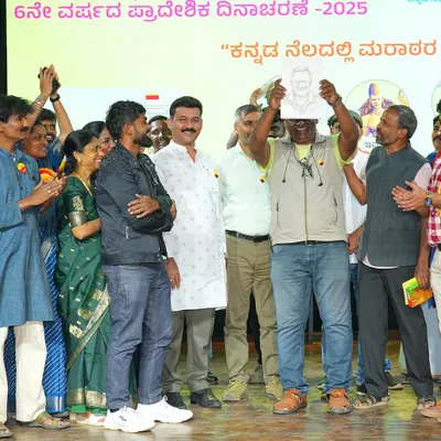 Presenting a hand-drawn sketch to the esteemed director T.S. Nagabharana at a Kannada cultural event. It's a joy to capture the portraits of people who have contributed so much to our culture.