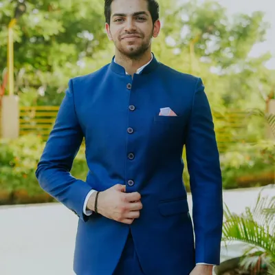 A customer looking sharp in our classic royal blue Jodhpuri suit. The clean lines, bandhgala collar, and perfect fit make it a timeless choice for any formal Indian occasion.