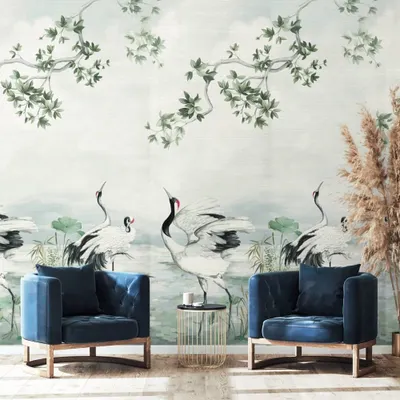 A serene scene unfolds in this design from the Daisy Bennett collection, where graceful cranes are depicted against a soft, watercolor-like background. Paired with deep blue velvet armchairs, the mural brings a soft, luminous poetry to the space.
