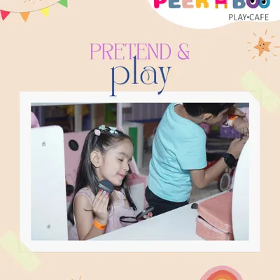 A little girl getting glamorous at our pretend makeup station. It's a safe and fun way for kids to experiment and play.