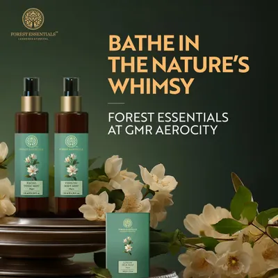 A product shot of Forest Essentials' facial and body mists, surrounded by fresh flowers. This image beautifully illustrates their philosophy of bathing in nature's whimsy with clean, botanical ingredients.