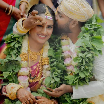A tender moment during the wedding ceremony, where the groom’s gentle gesture speaks volumes. I capture these unscripted interactions that reveal the depth of your connection.