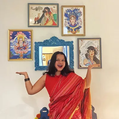 The art and the artist. Here I am in my element, standing proudly with a gallery wall of some of my favorite framed paintings.