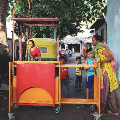 The true strength of the Madam Narangi cart lies in its ability to foster interaction. Its versatile design allows it to become a bench, a counter, or a display, creating a small node of community activity on the street.