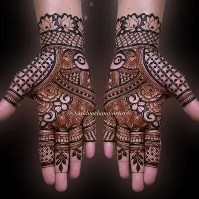 A classic, symmetrical full-hand design. I focus on clean lines and a balance of bold and delicate patterns to make the design pop.