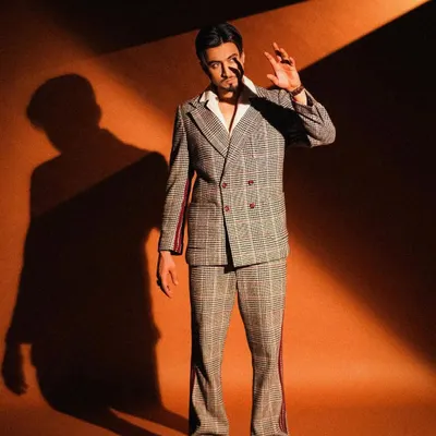 A behind-the-scenes shot from a shoot with creator Mr. Faisu. I styled him in a retro-inspired plaid suit with flared trousers, creating a cool, 70s vibe with a modern edge.