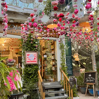A floral fantasy awaits. Our entrance is adorned with enchanting blooms and warm lights, setting the perfect mood for a session of self-care.
