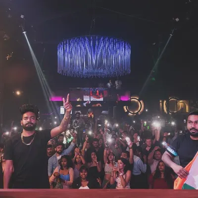 A proud moment celebrating Republic Day with the crowd at SinQ Nightclub in Goa, holding the Indian flag.