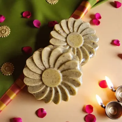 My Abhyangasnan Ubtan Soap, beautifully set for a festive ritual. It's crafted with a blend of turmeric, sandalwood, neem, and rose to detoxify and brighten your skin naturally.