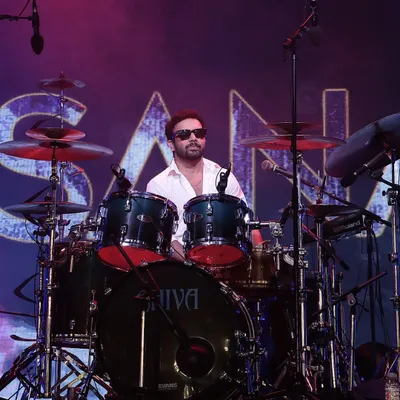 The drummer from Sanam Band performing on a stage we designed and managed, complete with professional lighting and sound.