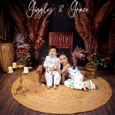 Giggles and grace. This portrait of two sisters captures the sweet and gentle love they share in our warm, rustic-themed setup.
