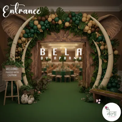 This dramatic entrance features massive mammoth tusks and elephant ears framing a wooden doorway. A "Proceed with Caution" sign, dinosaur eggs, and jungle-themed balloon garland set an adventurous tone right from the start.