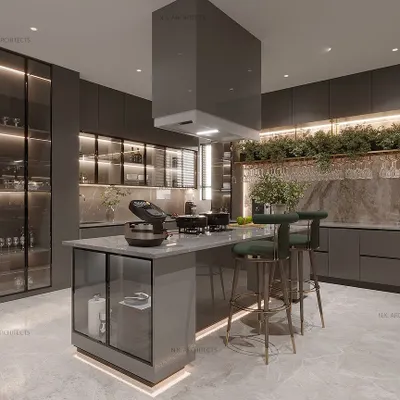 A kitchen with a grey and golden color scheme can create a very luxurious and modern look. This design features an island with bar seating, ample storage with glass-front cabinets, and a hanging rack for glasses, combining style with functionality.