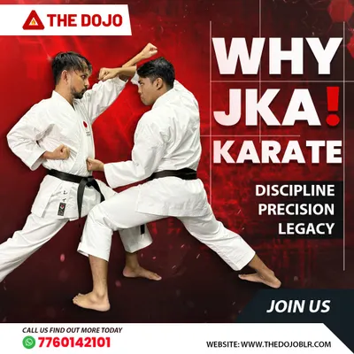 Two practitioners engage in JKA kumite, demonstrating the discipline and precision that this traditional style demands. Every block and strike has a purpose.
