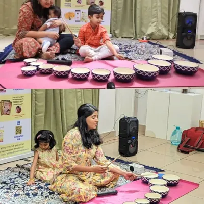 Mothers and their children learning to play the Jaltarang side-by-side. Our camps are curated as a unique kid-parent activity, creating a shared space for learning and fun.