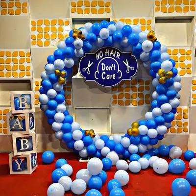 This is my most popular decoration for a Mundan ceremony. The large balloon ring with the playful "NO HAIR Don't Care" sign makes for a fun and memorable photo opportunity for your baby boy.