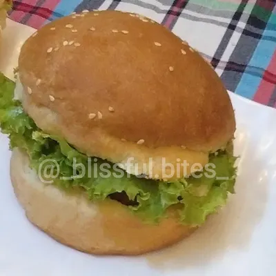 A simple and delicious homemade Zinger Burger, with a crispy chicken patty and fresh lettuce tucked into a soft, sesame-topped bun.
