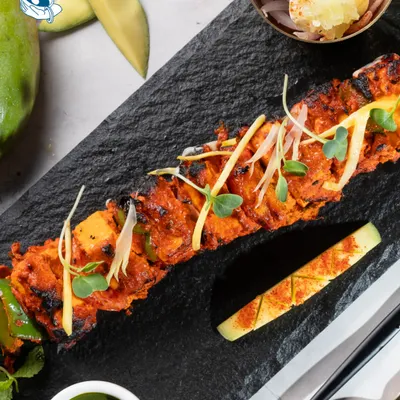 Our Mango Paneer Tikka is a signature creation, where classic tandoori paneer is elevated with the sweetness of mango for a unique flavor profile.