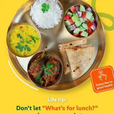 Life tip: Don't let "What's for lunch?" ruin your morning. A balanced thali with Bharwa Baingan, dal, rice, roti, and salad is the perfect answer to your midday hunger.
