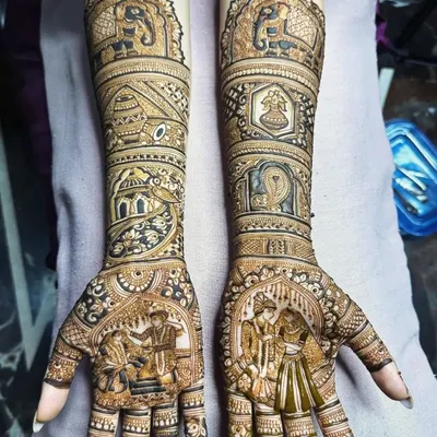 This narrative mehendi tells a wedding story with detailed figures of the bride and groom, the doli, and ceremonial elephants. This is a collaborative effort by our team for complex, story-based designs.