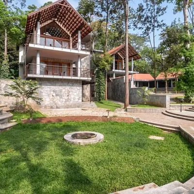 An outdoor amphitheater and fire pit at our coffee estate resort provide a natural gathering space for community events, surrounded by the sights and sounds of the forest.