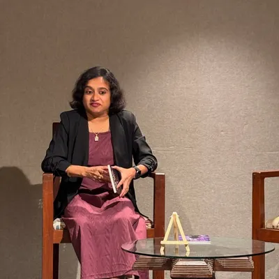 A glimpse into the weekend at our space. An author or speaker holds a book, ready to share her thoughts with an engaged audience.