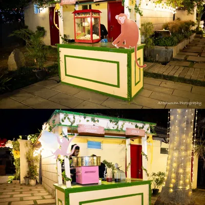 Fun is a key ingredient for a memorable event. We set up these charming, rustic stalls for popcorn and cotton candy, complete with whimsical monkey cutouts, adding a playful and interactive element that delighted guests of all ages.