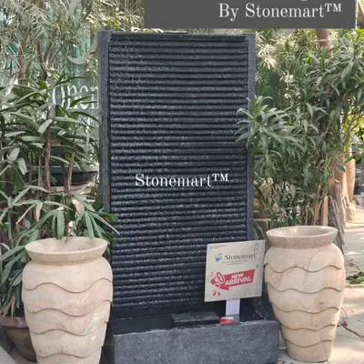 This is my 5-foot big-size garden fountain, featuring a ribbed granite panel. It's a contemporary piece that can be placed against a wall indoors or outdoors.